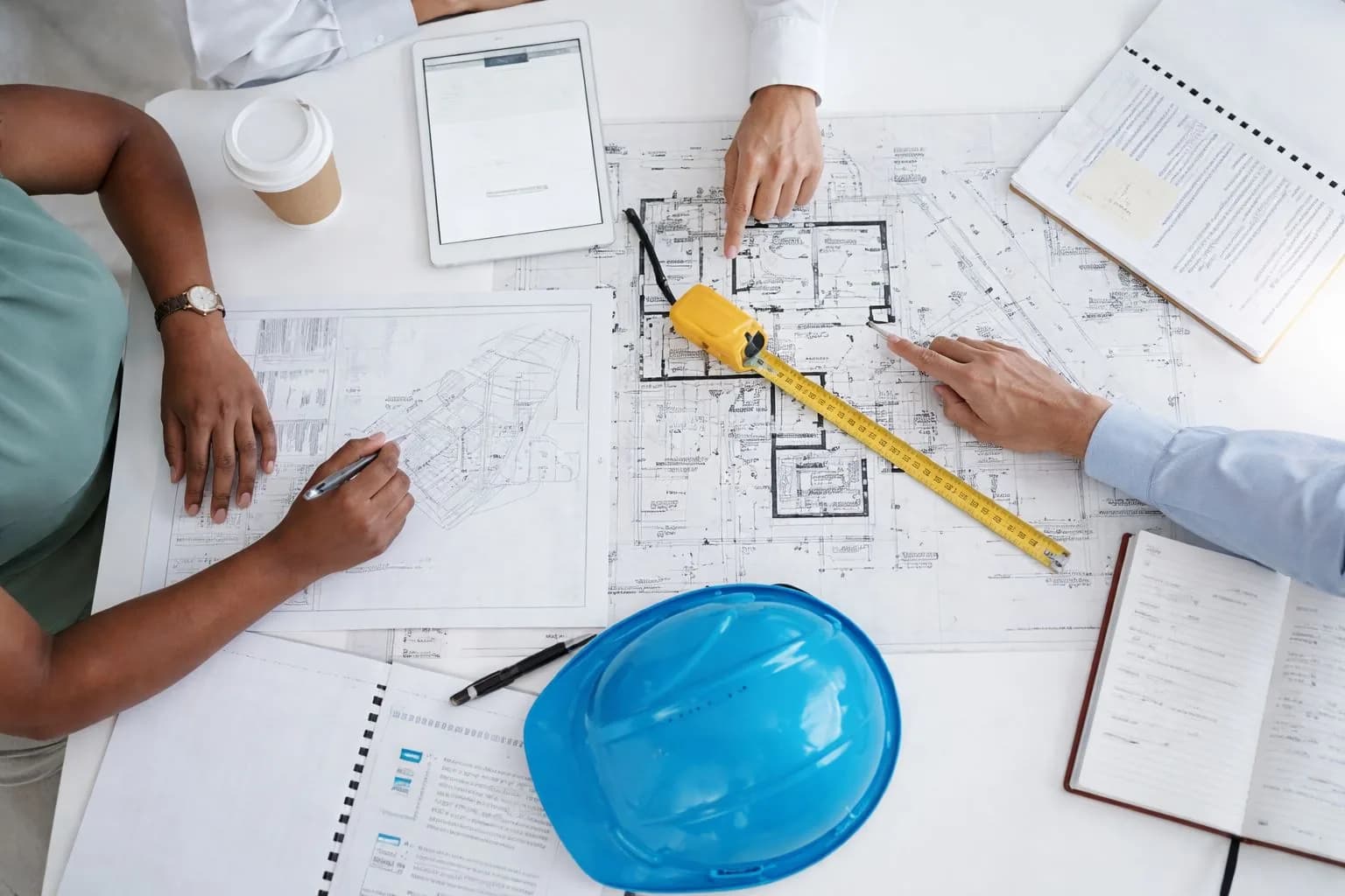 Project management team reviewing pipeline automation plans.